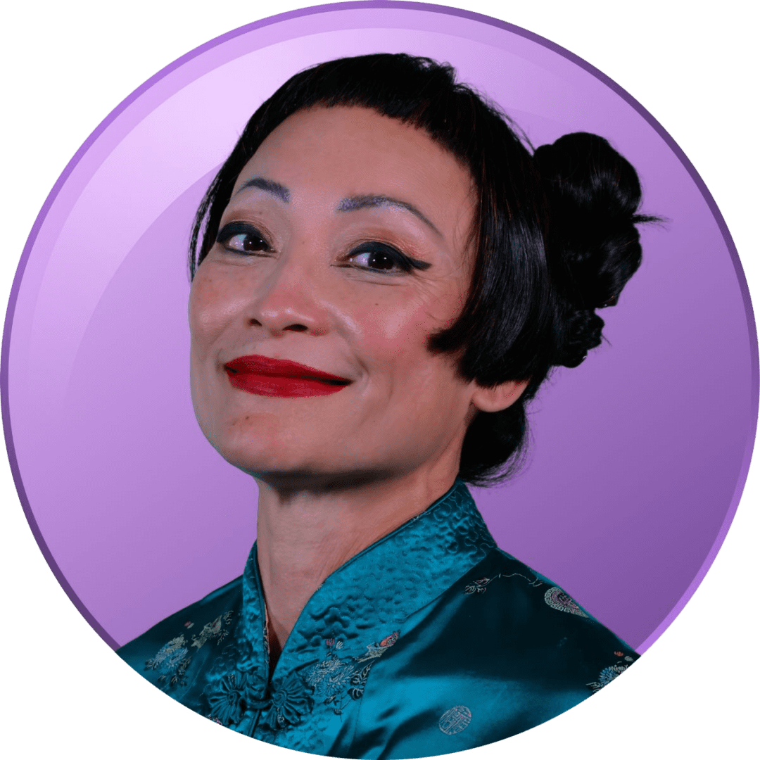 Woman with styled hair and red lipstick against purple background.